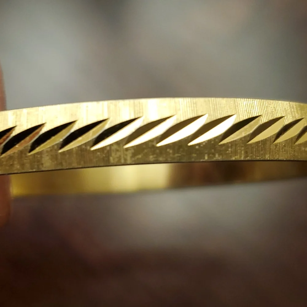 MONET Gold Tone Etched Bangle Bracelet